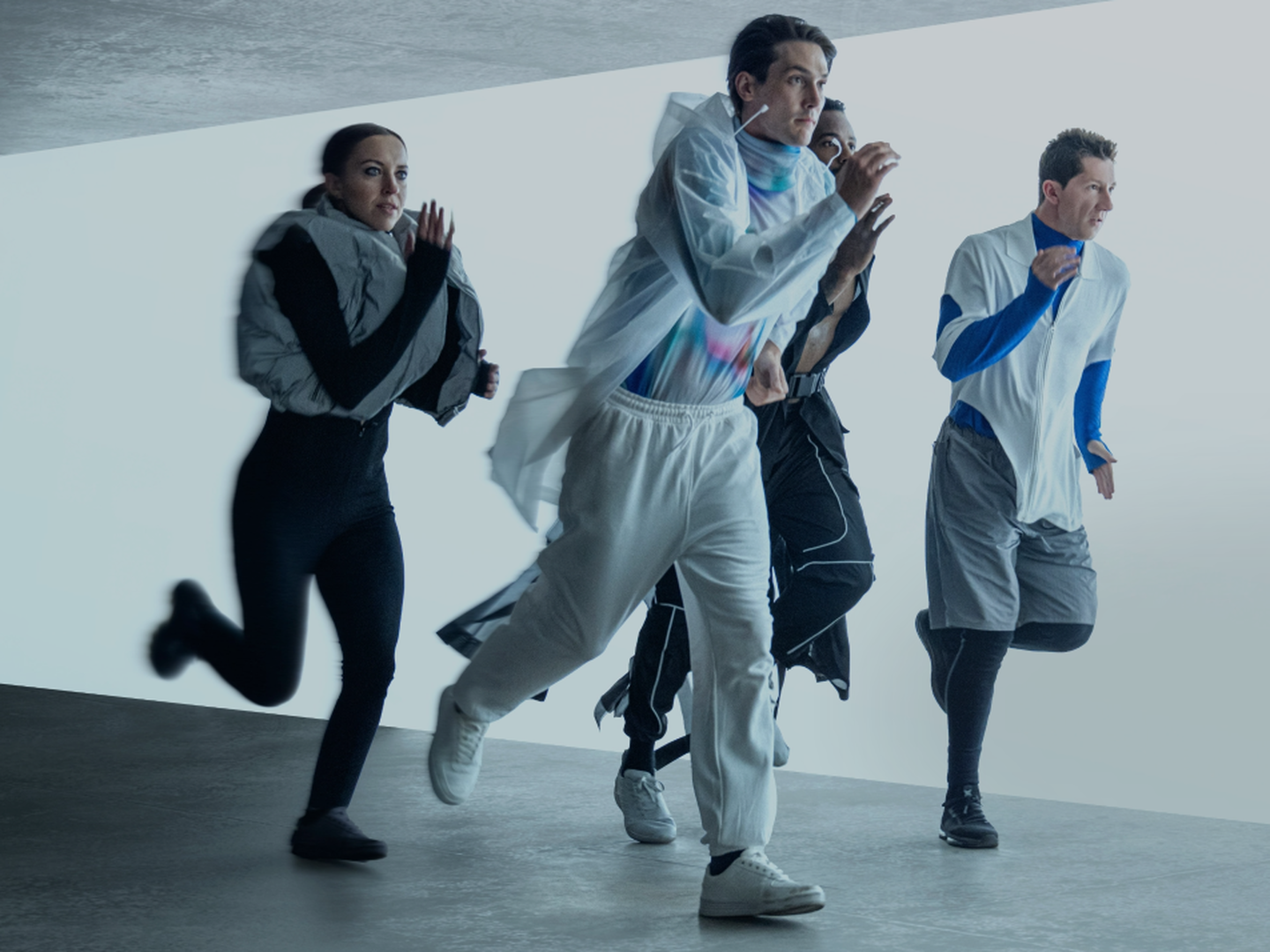 Group of 4 people are running inside a clean room