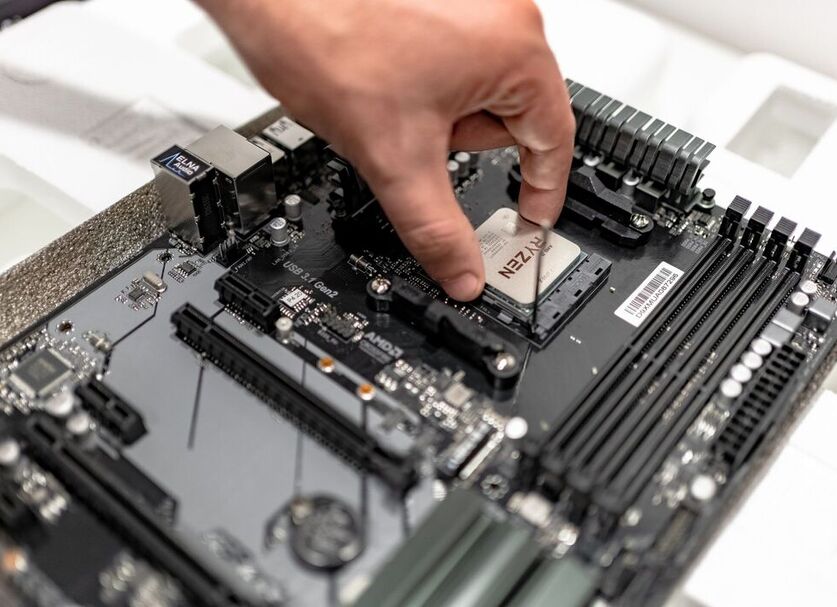 A hand of a man checking a hardware system